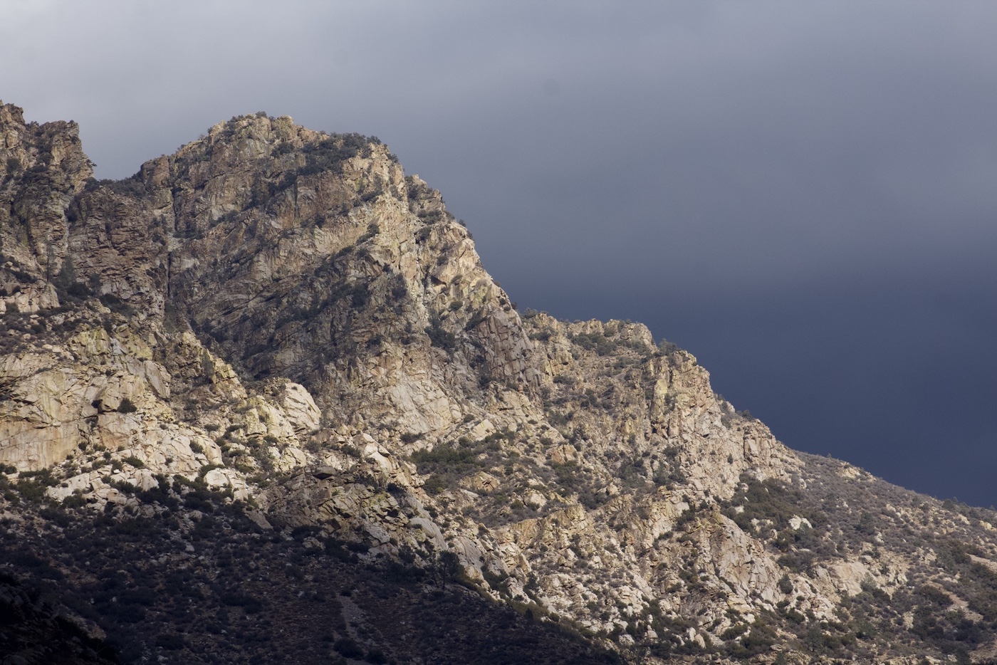 Evening light on the Sierra Nevada with stormclouds in the distance